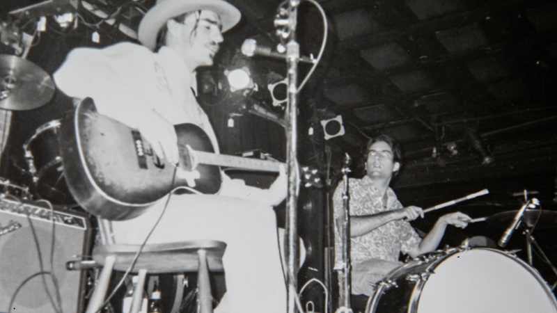 Jason Molina looks like a pirate in a cowboy hat, plays an early show in NYC 1994. A still from a film by Tommy Nickoloff, You Fuckers Figure It Out. Jason Molina Documentary; Music Documentary; Indie Film; New York City; Songs: Ohia; Magnolia Electric Co.; YFFIO